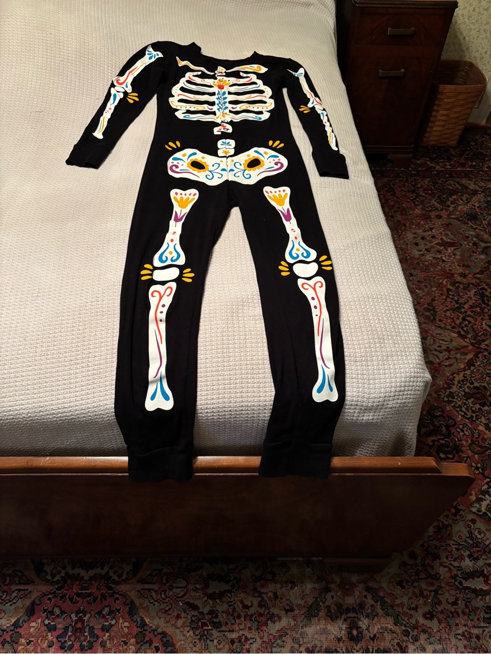 Kids Black One-Piece Skeleton Pajamas with Colorful Bone Print size 10